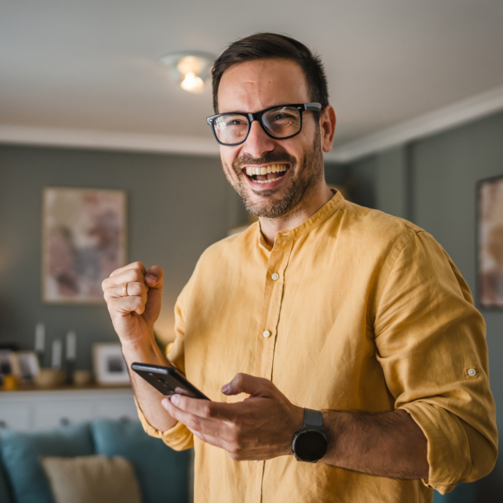 happy man holding phone